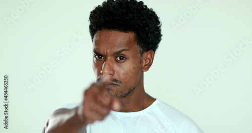 Upset African man pointing finger arguing. Black man in argument gesturing blaming