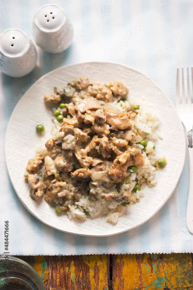 Chicken shoarma with mushrooms in creamy sauce served with rice and peas Chicken shoarma with mushrooms in creamy sauce served with rice and peas