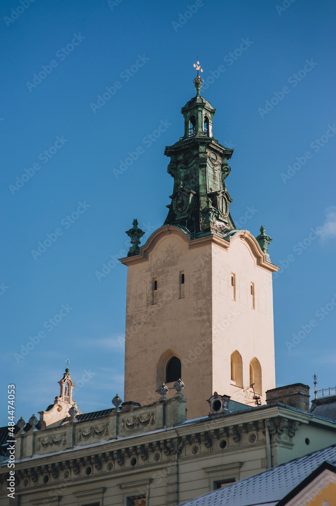 Tower of the Latin Cathedral of the Assumption of the Virgin Mary in Lviv. Historical part of the city, view from below against the blue sky.