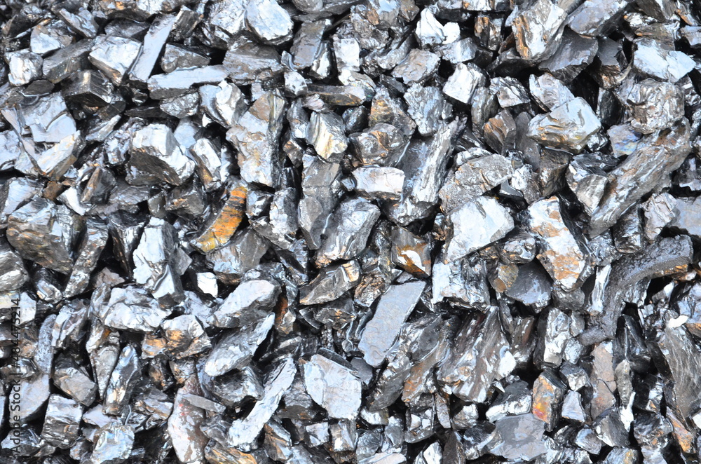 The texture of wet shiny anthracite coal is suitable as a background. The texture of wet shiny anthracite coal is suitable as a background.