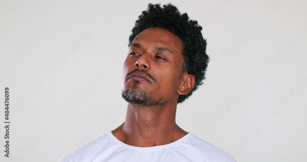 Judgmental person looking to camera feeling superior. African man portrait feeling annoyed Judgmental person looking to camera feeling superior. African man portrait feeling annoyed