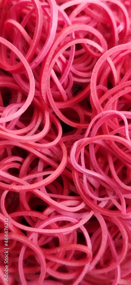 Red colour rubber bands background