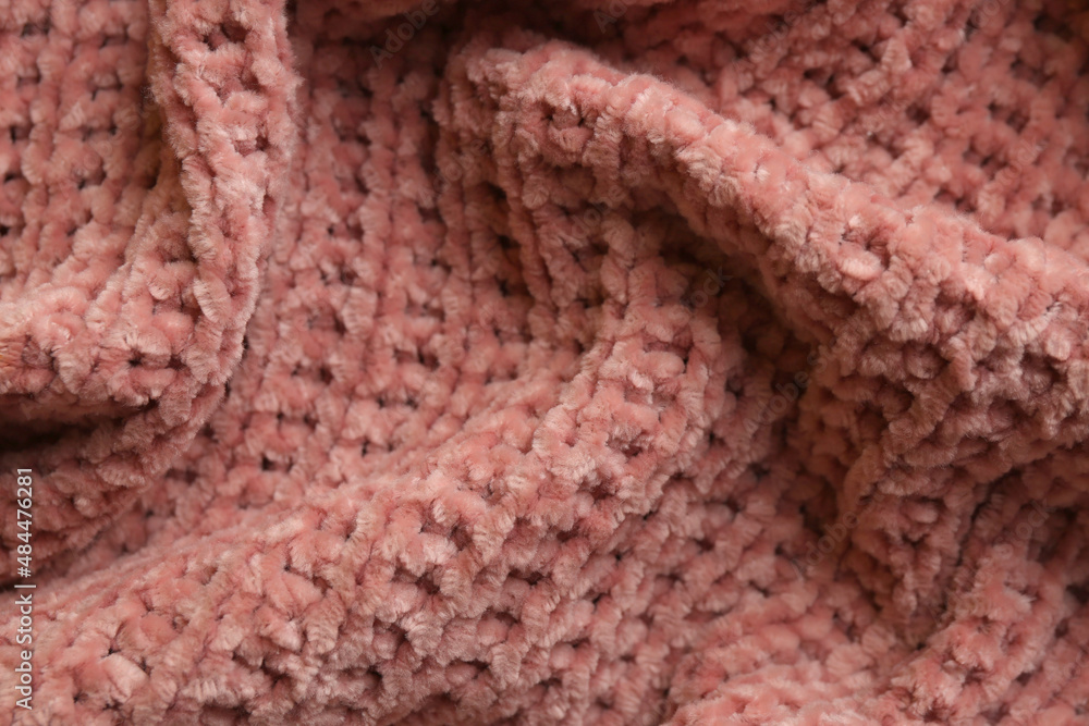 Fototapeta premium Beautiful pink knitted fabric as background, closeup