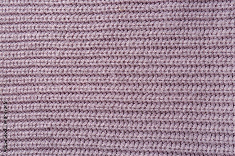 Beautiful violet knitted fabric as background, top view