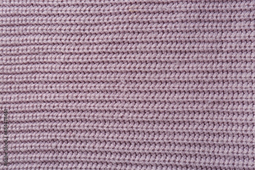 Beautiful violet knitted fabric as background, top view Beautiful violet knitted fabric as background, top view