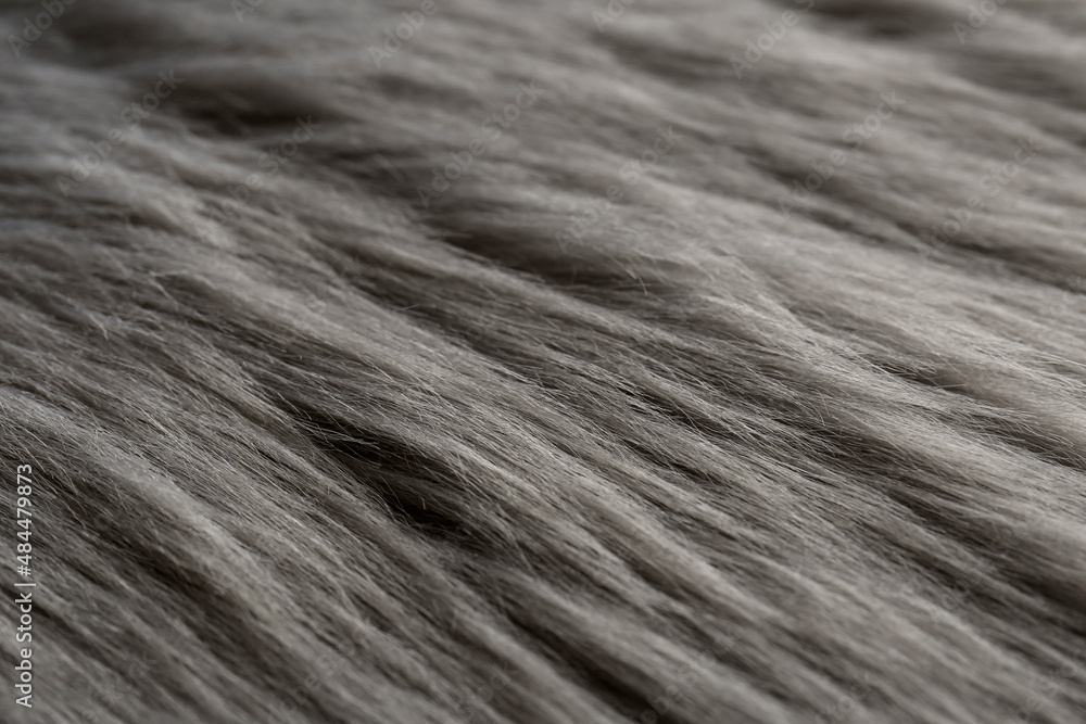 Fototapeta premium Beautiful grey faux fur as background, closeup view