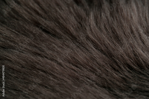 Beautiful dark faux fur as background, closeup view