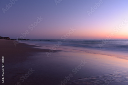 Sunset on the beach of Cape Trafalgar with the lighthouse in the background  Canos de Meca  Cadiz  Andalusia  Spain