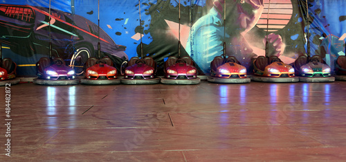 Electric bumper cars ready to use. Funfair entertainment Amusement park with dodgems bumper cars. © PaulSat