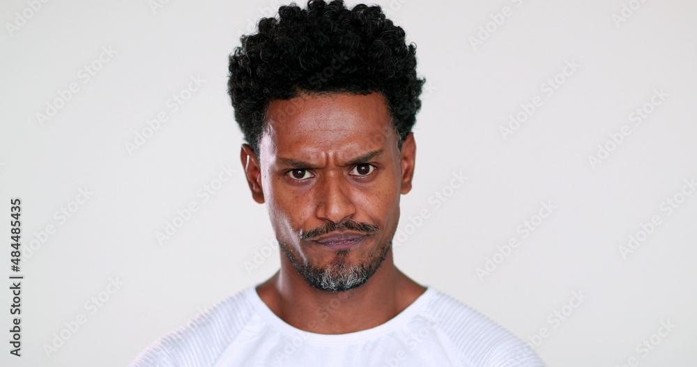 Angry black African person feeling pissed off looking to camera Angry black African person feeling pissed off looking to camera