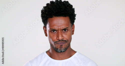 Angry black African person feeling pissed off looking to camera
