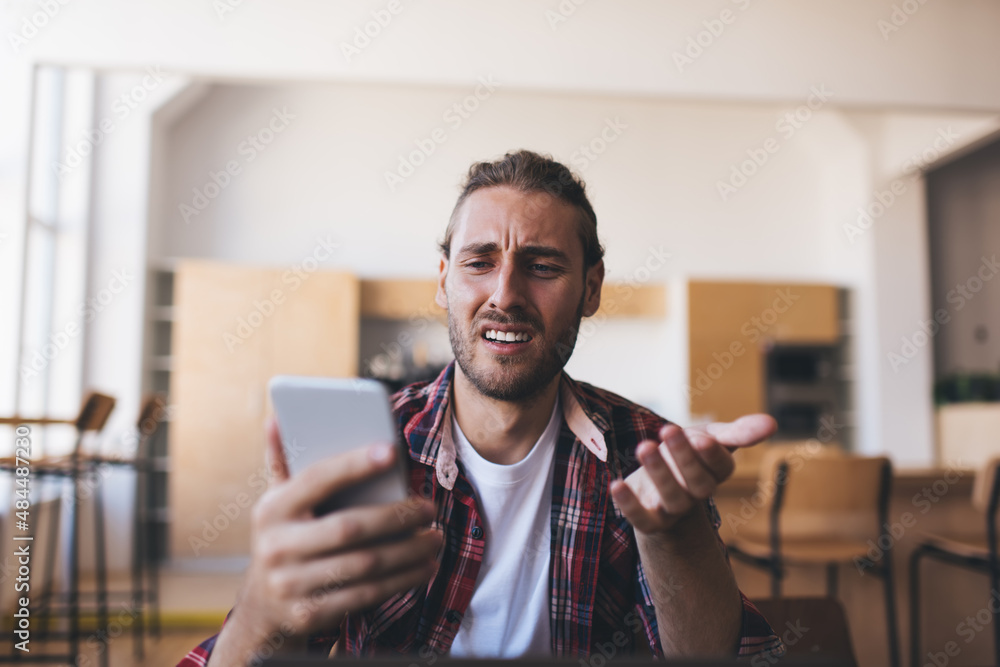 Millennial businessman working at desk in office