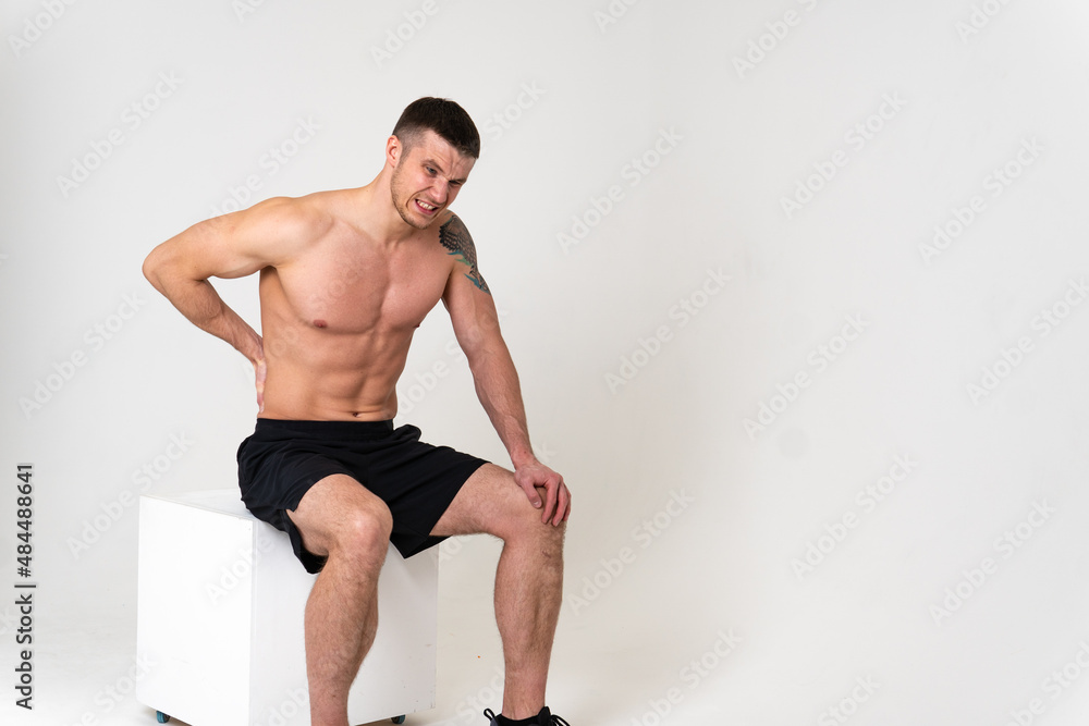 Obraz premium A man back pain keeps his hand on his back pain hurt painful, backache person man health medicine, muscular lumbar care, ain suffer attractive