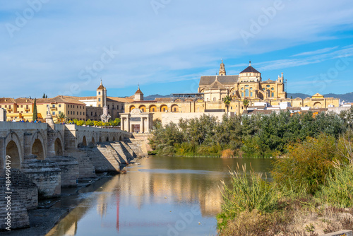 The Great Mosque of Córdoba or Mezquita seen from the Roman Bridge along the Guadalquivir River in Cordoba, Spain.
