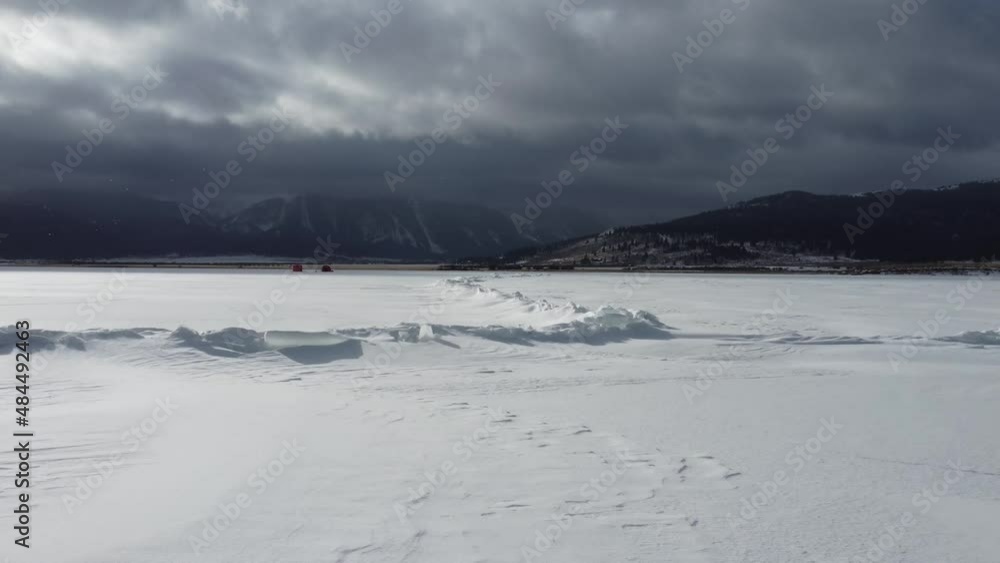 Drove flying over crack in frozen lake