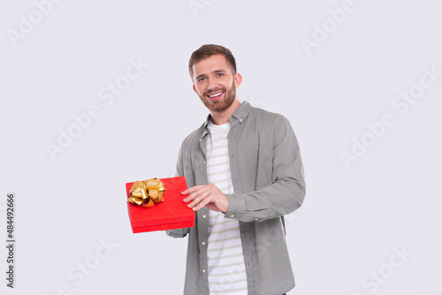 Man Holding Present Watching Whats inside. Man Holding Gift. Surprise. Looking to Camera