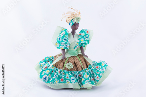 A Handmade Black Doll On White Background