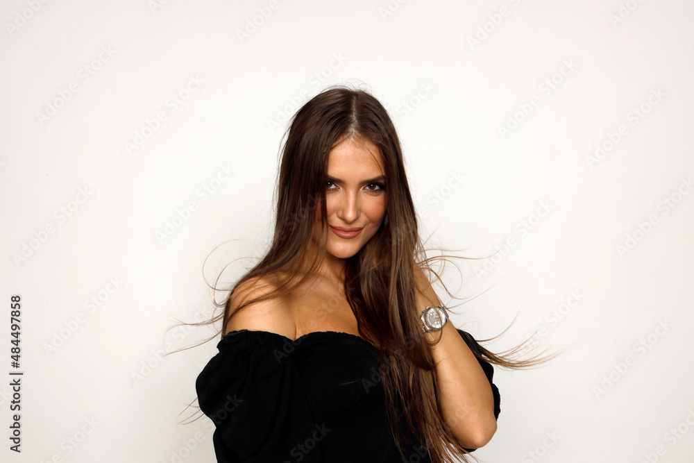 Attractive brunette girl is posing in studio. Style, trends, fashion concept. Attractive brunette girl is posing in studio. Style, trends, fashion concept.