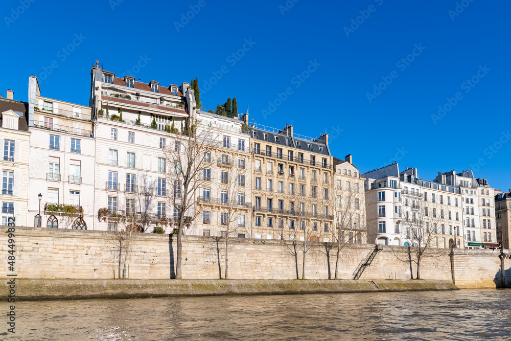 Paris, beautiful facades quai d’Orleans, on the ile Saint-Louis, sunny day in winter
