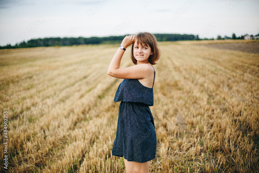 A beautiful girl and a field on which they threshed grain. Woman after harvest. Girl and yellow field
A beautiful girl and a field on which they threshed grain. Woman after harvest. Girl and yellow field
