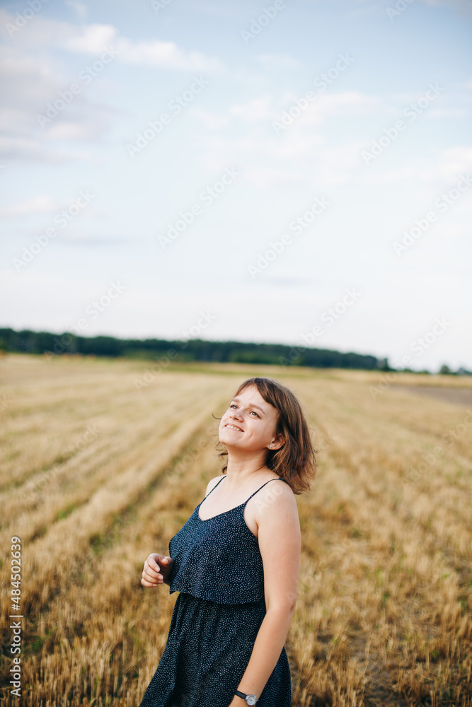 A beautiful girl and a field on which they threshed grain. Woman after harvest. Girl and yellow field
A beautiful girl and a field on which they threshed grain. Woman after harvest. Girl and yellow field