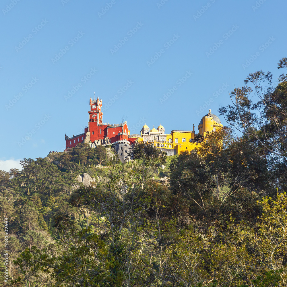 bottom view of the Pena Palace in pseudo-medieval style, which is located on a high cliff above the Portuguese city of Sintra