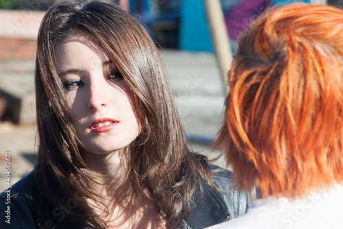 Konstfotografi Beautiful young brunette woman with blue eyes, red lipstick, and dark eye makeup
