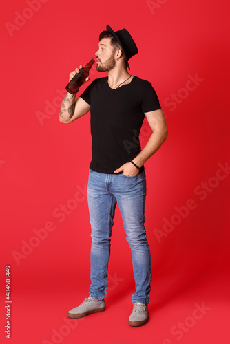 Stylish young man drinking ...