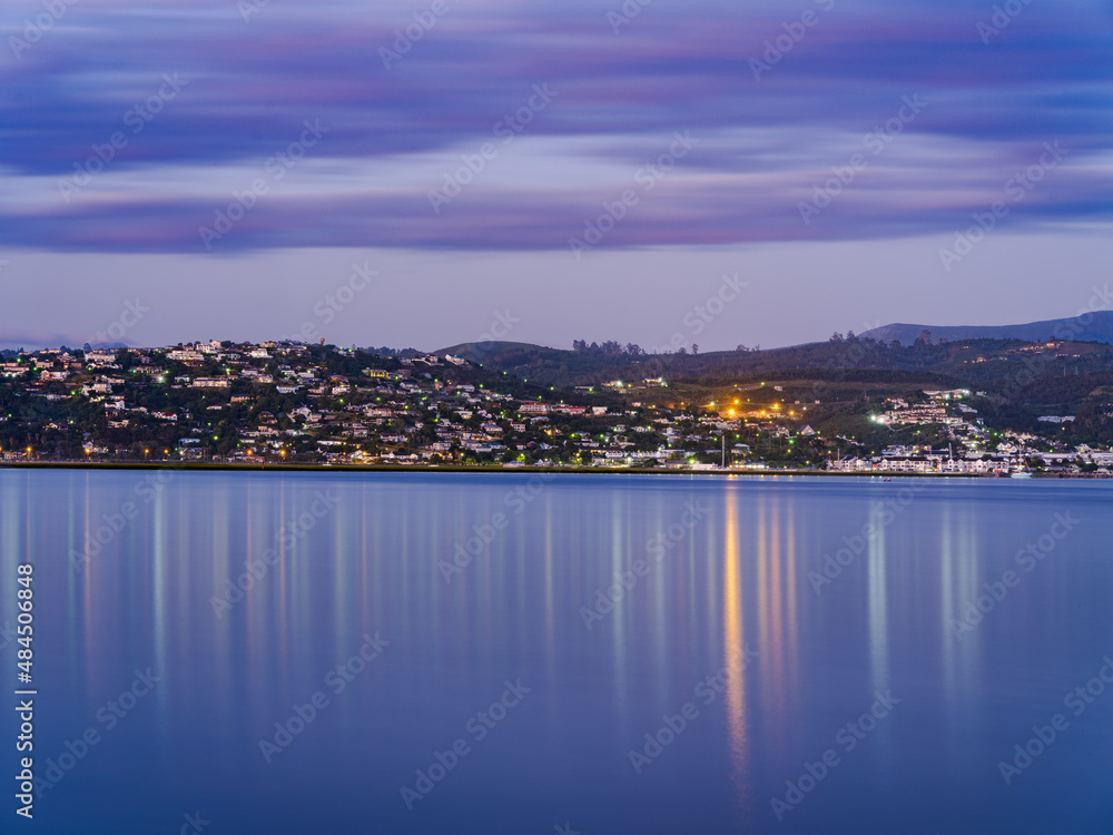 Fototapeta premium Knysna town lights reflection on the lagoon after sunset in South Africa