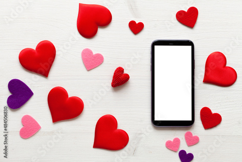 St. Valentine Day mock-up with tablet and red hearts, top view