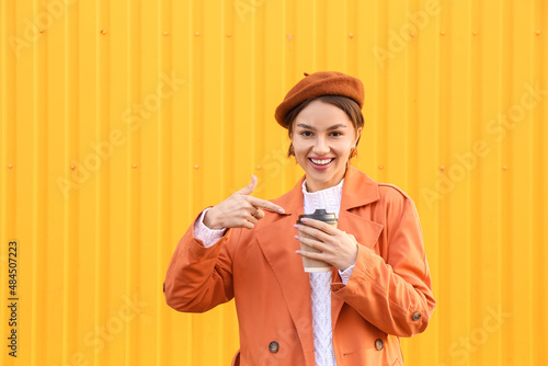 Elegant woman pointing with...