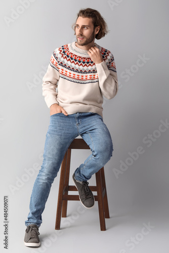 Handsome young man in knitt...