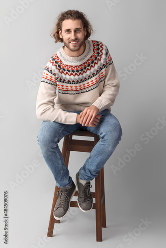 Handsome young man in knitt...