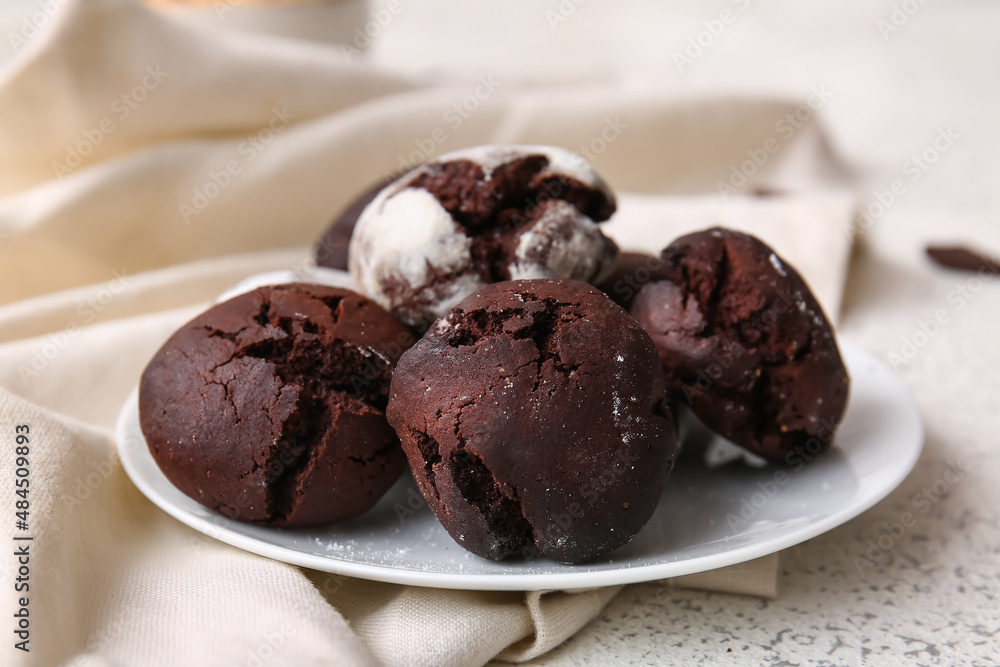 Plate of chocolate brownie cookies on light background Plate of chocolate brownie cookies on light background