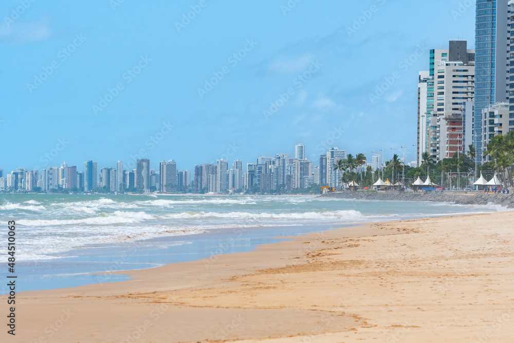 Beautiful beach of the brazilian northeast, view to the beach and the city buildings on the background. Boa Viagem beach in Recife, PE, Brazil. Beautiful beach of the brazilian northeast, view to the beach and the city buildings on the background. Boa Viagem beach in Recife, PE, Brazil.