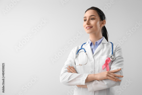 Female oncologist with pink...