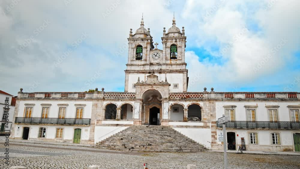 Santuário de Nossa Senhora da Nazaré, Catholic church near Miradouro do Suberco. Traditional Portuguese architectural building in Nazaré a Town in Portugal, Europe in 4K. Santuário de Nossa Senhora da Nazaré, Catholic church near Miradouro do Suberco. Traditional Portuguese architectural building in Nazaré a Town in Portugal, Europe in 4K.