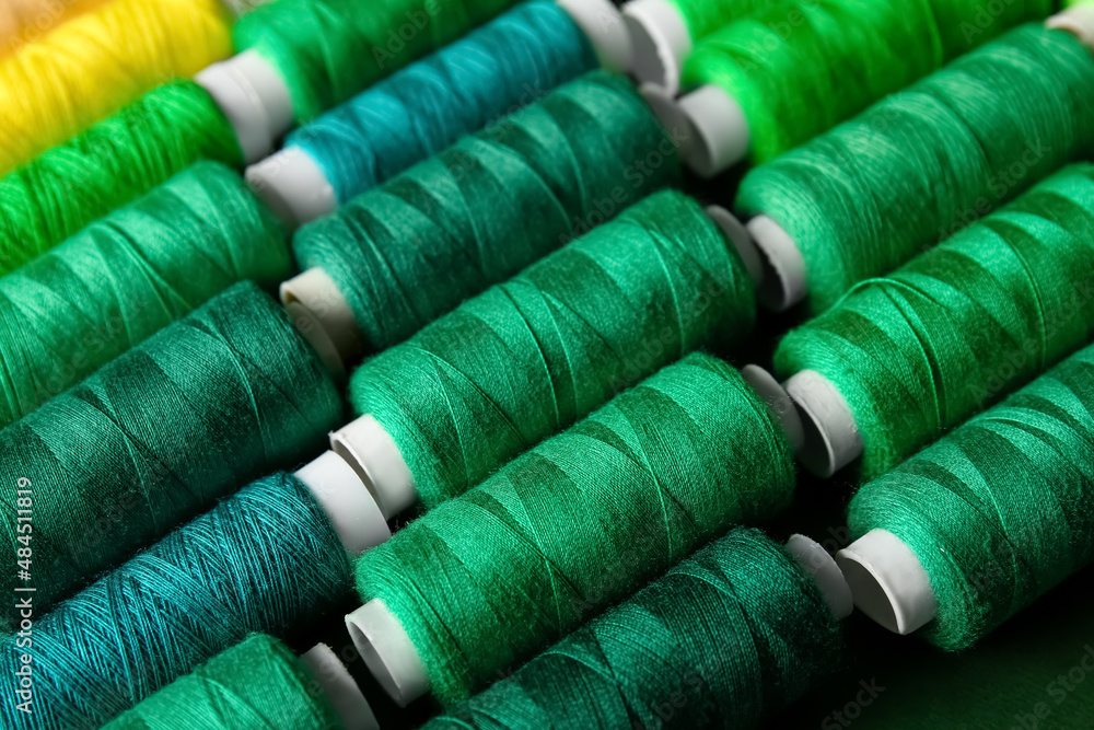 Spools with green threads, closeup Spools with green threads, closeup