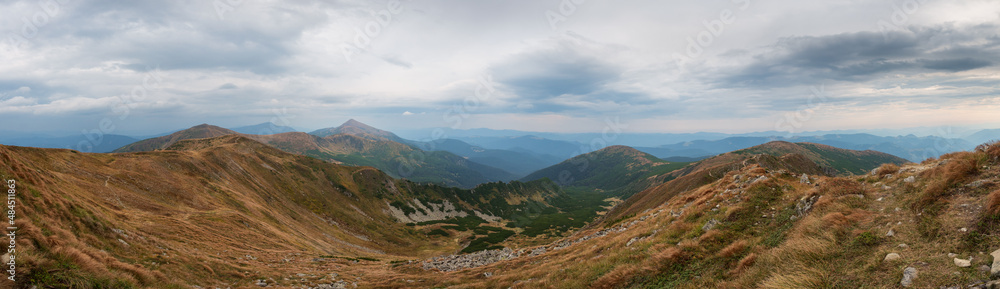 Naklejka premium Panoramic mountain landscape. Cloudy sky. Mount Hoverla in the background. Chornohora mountain range. Western Ukraine.