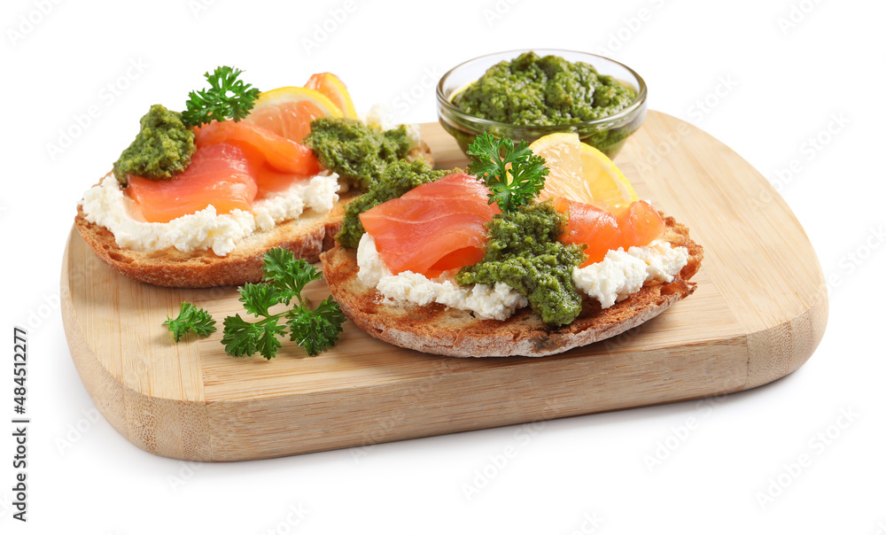 Delicious bruschettas with cream cheese, salmon and pesto sauce on white background Delicious bruschettas with cream cheese, salmon and pesto sauce on white background
