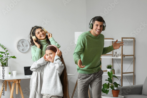 Happy family in warm sweate...
