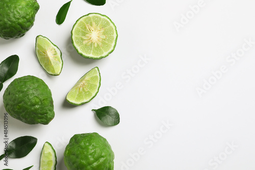 Flat lay composition with ripe bergamot fruits on white background. Space for text photo