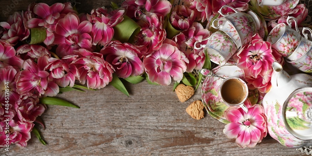 top view background with tulips and tea set. top view background with tulips and tea set.