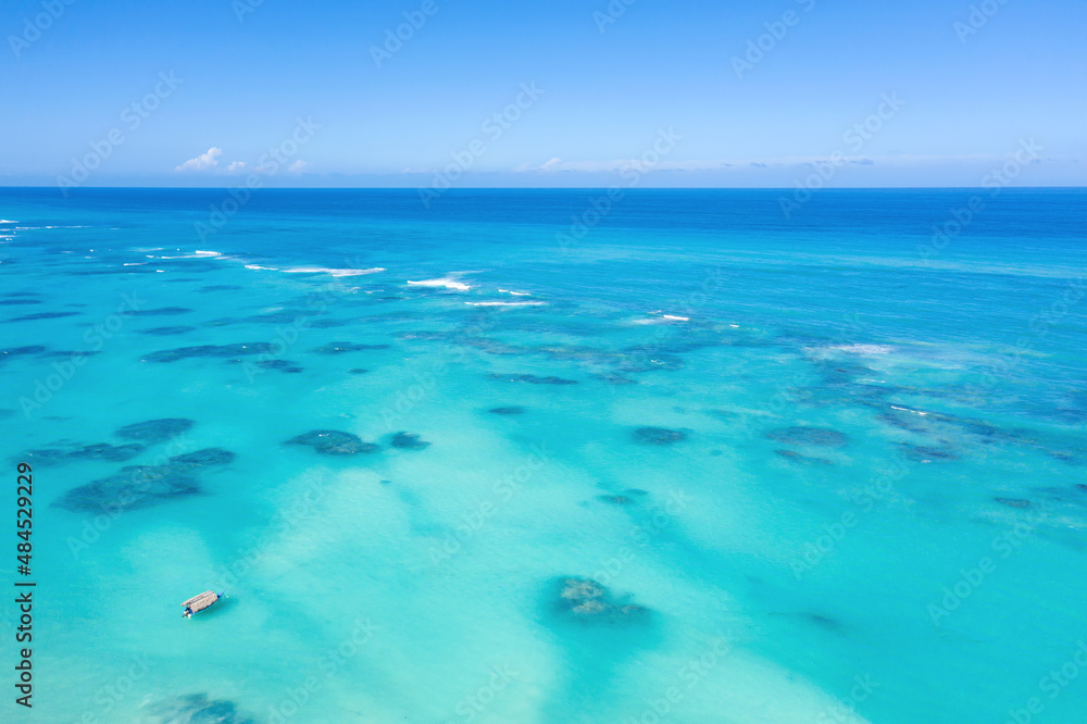 Atlantic ocean with turquoise water, reef and waves. Caribbean nature. Aerial view
