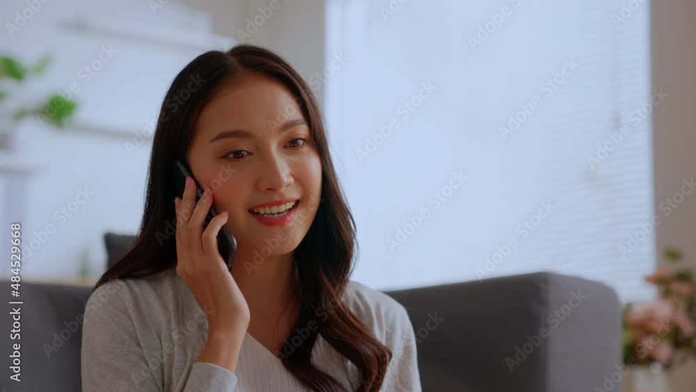 Smiling charming young business woman professional talking on phone sit at home , happy female customer make mobile call confirming online website shopping order delivery concept Smiling charming young business woman professional talking on phone sit at home , happy female customer make mobile call confirming online website shopping order delivery concept