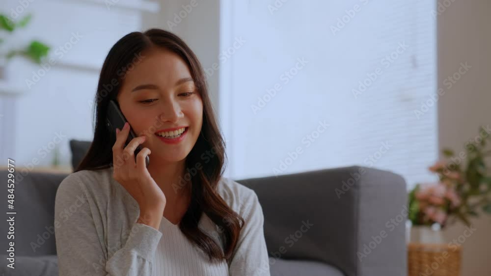 Smiling charming young business woman professional talking on phone sit at home , happy female customer make mobile call confirming online website shopping order delivery concept Smiling charming young business woman professional talking on phone sit at home , happy female customer make mobile call confirming online website shopping order delivery concept