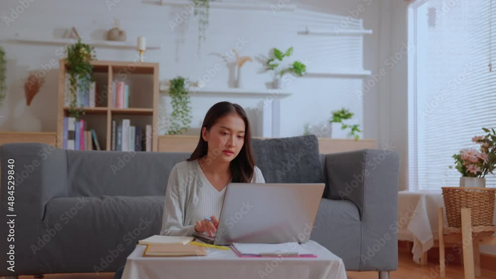 Young asian business woman communicating by video call. Businesswoman working at laptop computer, online conference distance office chat, Working from home, Working remotely and Self isolation at home Young asian business woman communicating by video call. Businesswoman working at laptop computer, online conference distance office chat, Working from home, Working remotely and Self isolation at home