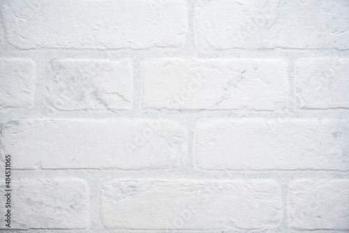 The modern texture of a white brick wall can be used as a background or a sample for a design. High quality photo