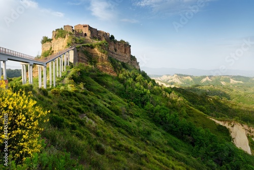 Summer evening view of famous Civita di Bagnoregio town, beautiful place located on top of a volcanic tuff hill overlooking the Tiber river valley