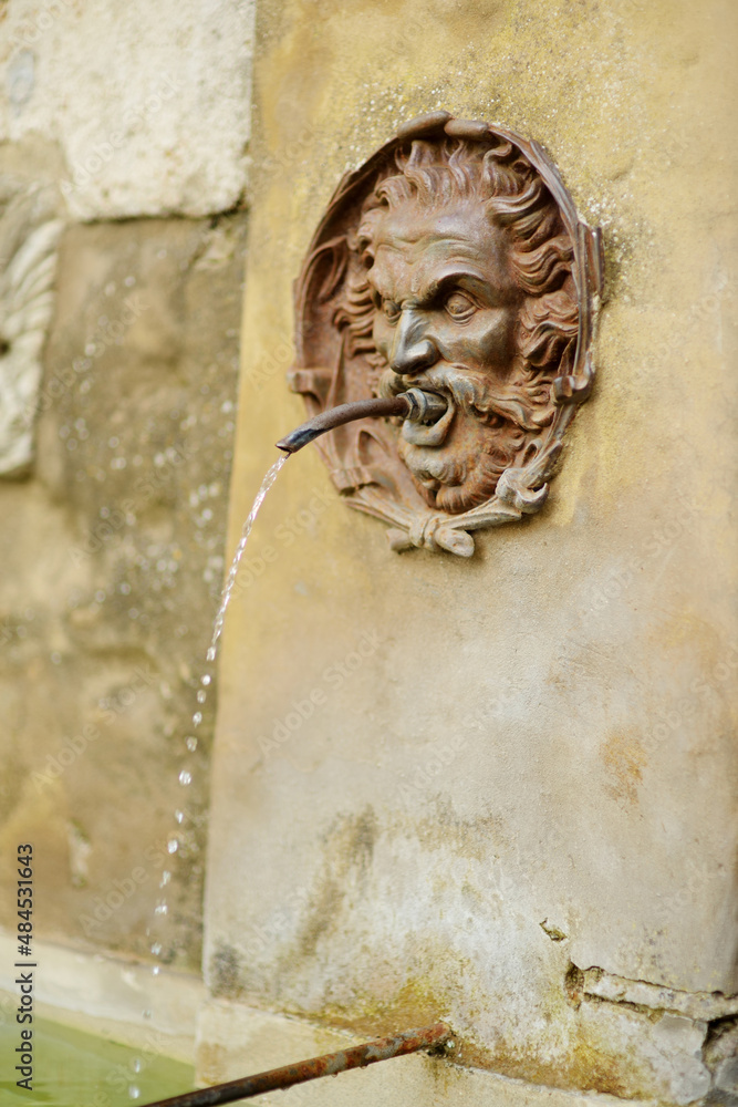 Old drinking water fountain of the famous Pitigliano town, located atop a volcanic tufa ridge. Beautiful italian towns and villages. Etruscan heritage, Grosseto, Italy.